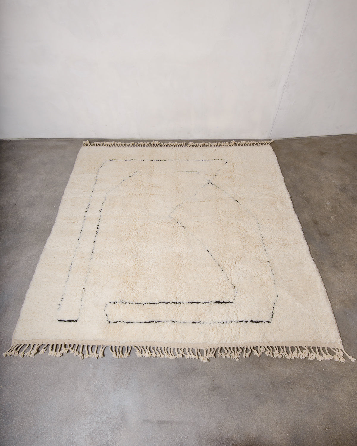 Modern, designer, handcrafted Berber rug from Morocco. Beniourain carpet with minimalist design, natural wool pile and a fluffy texture.